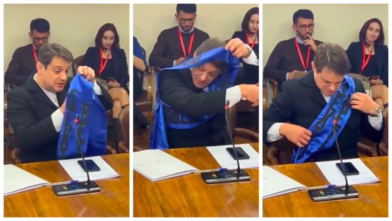 Gaspar Rivas con problemas para poners banda del sexto retiro.jpg